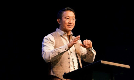 Christopher Yuan speaks at an event, 2018.