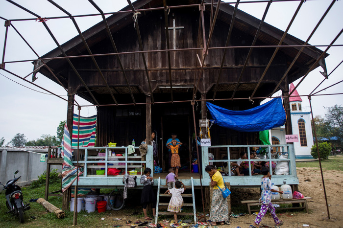 Internally displaced people, fleeing renewed fighting between Myanmar's army and ethnic insurgents in the country's remote north, take shelter at a church compound in Nanmati, Kachin state, on May 12, 2018.
