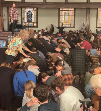 Students crowd the altar at Hughes Auditorium at Asbury University in Wilmore, Kentucky, during a revival event that began on Feb. 8, 2023.