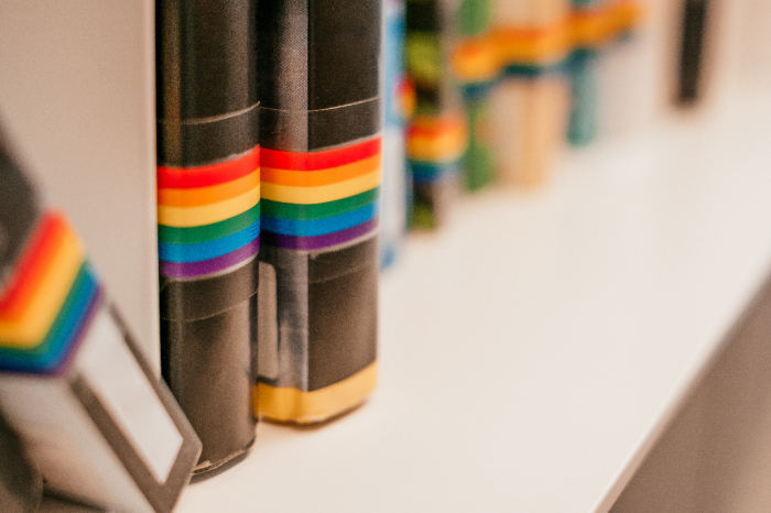 Books with rainbow-colored spines.