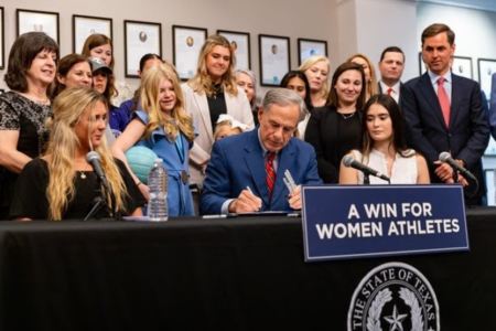 Texas Gov. Greg Abbott signs the Save Women's Sports Act in Denton, Texas, August 7, 2023.