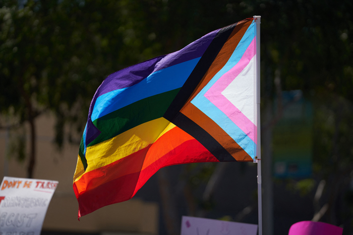 A progress pride flag is held above the crowd of LGBT activists during the Los Angeles LGBT Center in West Hollywood, California, on April 9, 2023.