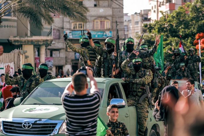 Hamas militants parade at a rally just over a week after a cease-fire was reached in an 11-day war between Hamas and Israel.