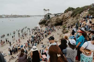 People are being baptized at the second annual Jesus Revolution Baptism at Pirate's Cove Beach in Corona Del Mar, California, on Saturday, July 27, 2024.