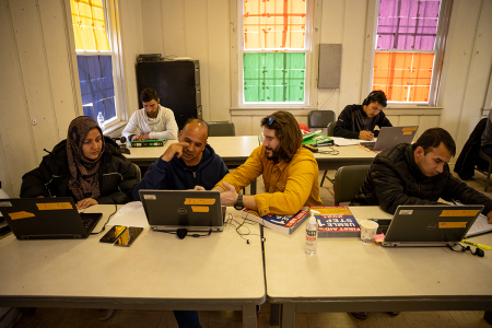 Afghan medical doctors study for American licensure in the computer lab at an Afghan refugee camp at Fort Pickett on Dec. 16, 2021, in Blackstone, Va. Fort Pickett normally operates as an Army National Guard maneuver training center, but converted its capabilities to house up to 10,000 Afghan refugees as of Aug. 28, 2020. Approximately 5,500 refugees have been resettled in permanent housing, and the camp is beginning the process of being descoped as Operation Allies Welcome comes to a close.