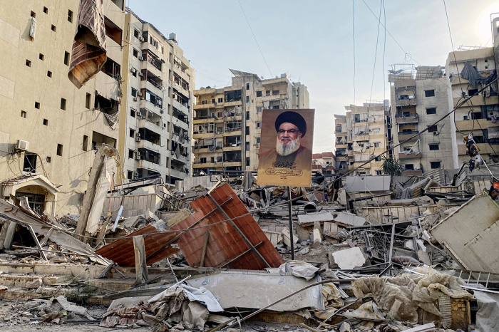 A portrait of slain Hezbollah leader Hassan Nasrallah sits amids debris at Beirut's southern suburb Rouweiss neighbourhood on Oct. 10, 2024, following overnight Israeli strikes. The United States urged its ally Israel to avoid Gaza-like military action in Lebanon, after Prime Minister Benjamin Netanyahu said it could face 'destruction' like the Palestinian territory.