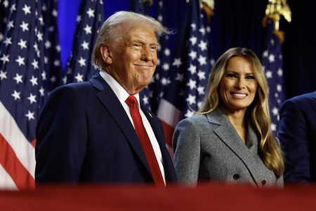 Republican presidential nominee, former U.S. President Donald Trump and former first lady Melania Trump look on during an election night event at the Palm Beach Convention Center on Nov. 06, 2024, in West Palm Beach, Florida. Americans cast their ballots today in the presidential race between Republican nominee former President Donald Trump and Vice President Kamala Harris, as well as multiple state elections that will determine the balance of power in Congress.