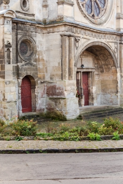 The Renaissance west facade of the Church of St. Cosmas and St. Damian in Luzarches, France.