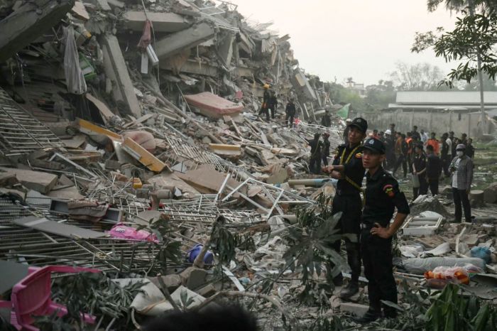 Rescuers search for survivors trapped in the collapsed Sky Villa Condominium building in Mandalay on March 29, 2025, a day after an earthquake struck central Myanmar. Rescuers pulled a woman alive from the wreckage of a collapsed apartment building in Mandalay on March 29, AFP journalists saw, 30 hours after a devastating quake hit Myanmar. (Photo by Sai Aung MAIN / AFP) (Photo by SAI AUNG MAIN/AFP via Getty Images)