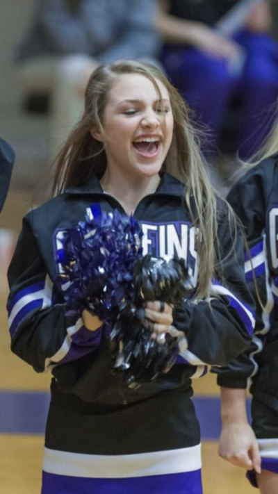 Emma Benoit in her high school years as a varsity cheerleader